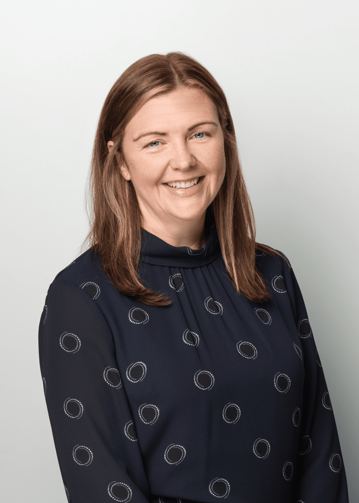 An image of Nicola Maclennan wearing a blue top and smiling at the camera.