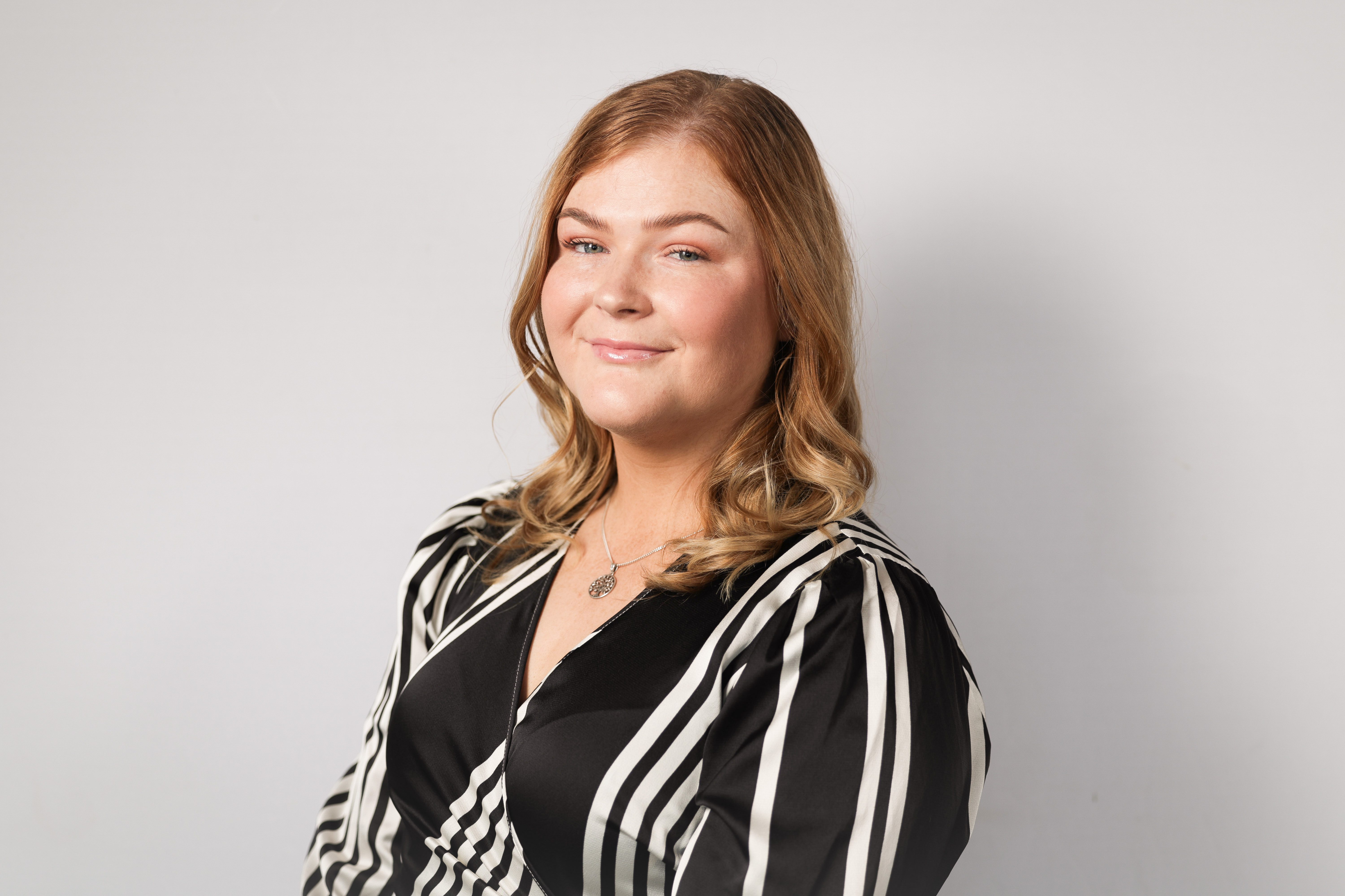 An image of Charlotte Eakin smiling at the camera.