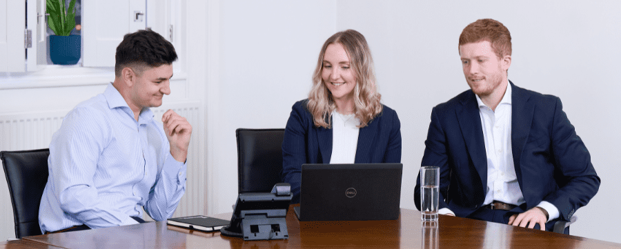 Image of AAB team members having a meeting about tax for private client services
