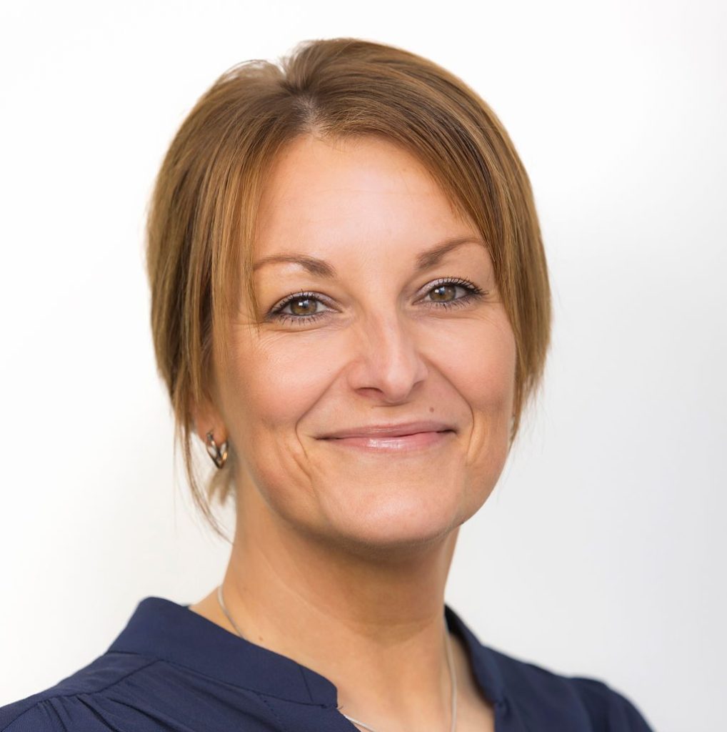 An image of Rachel Coupland wearing a navy top and smiling at the camera.