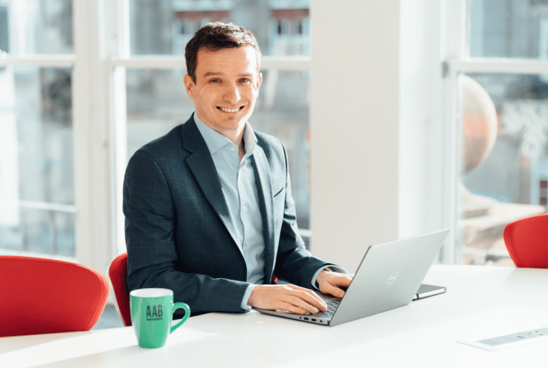 Image of Jordan Taylor sitting at a laptop.