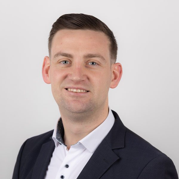 Brian Dunne looking towards camera with a smile.