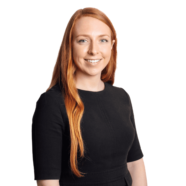 An image of Jen Armstrong wearing a black top and smiling at the camera.