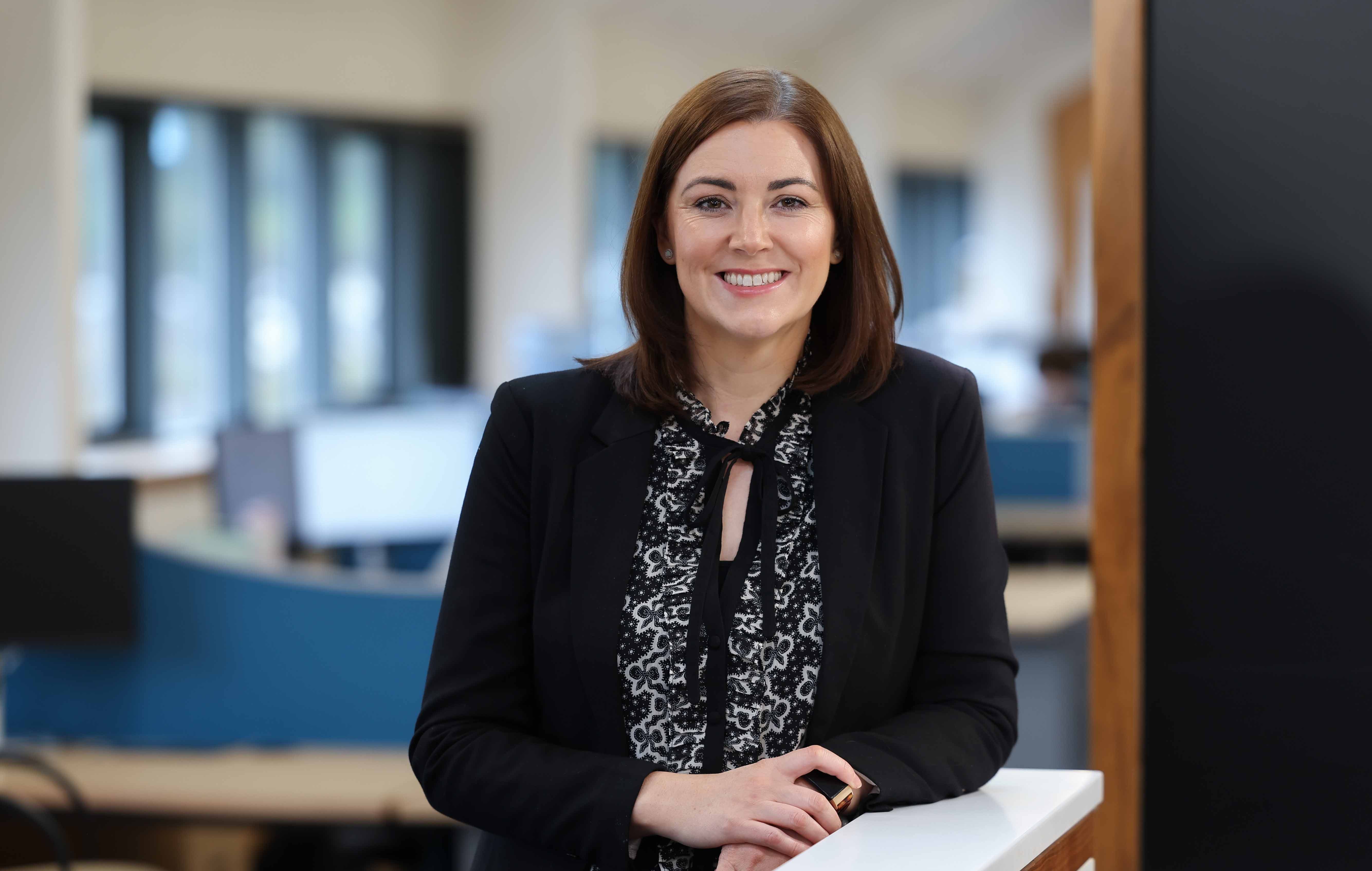 An image of Tanya O Hare standing in the office.